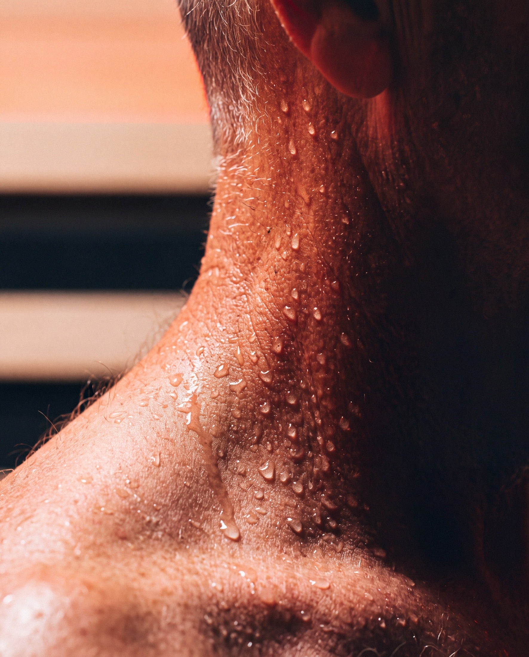 Close-up of sweat on a man in the heat of an infrared sauna